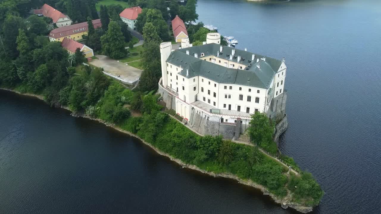 Orlik Castle And Vltava River With Calm Water In Daytime In Czech Republic. - aerial shot