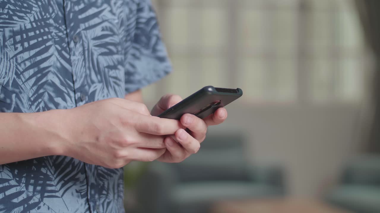 Hands Man Using Mobile Phone In Living Room At Home, Video In 4K