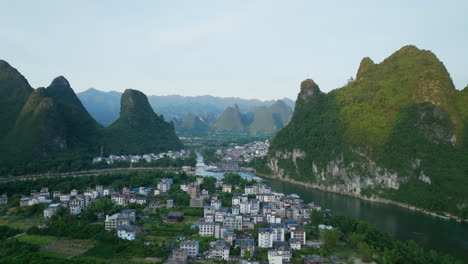 establishing drone shot of the xingping ancient town, summer sunset in china