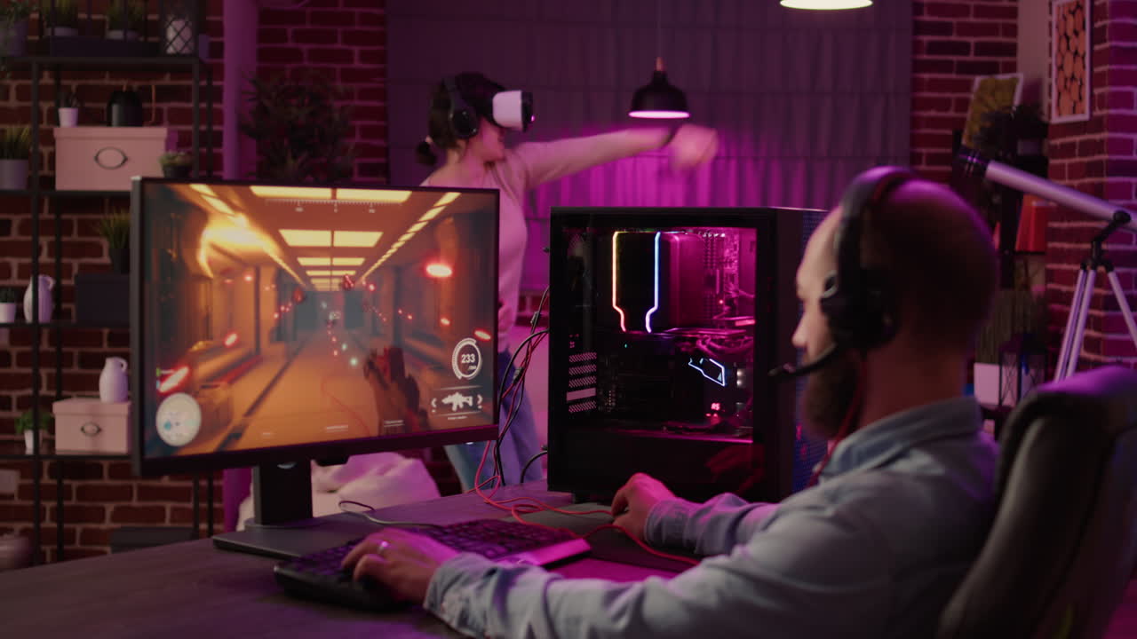 Gamer streaming first person shooter on pc while woman uses vr goggles for simulation