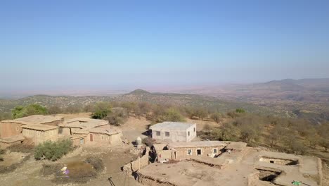 Drone-view-of-the-small-town-located-on-the-rocky-cliff