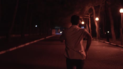 man running at night in park