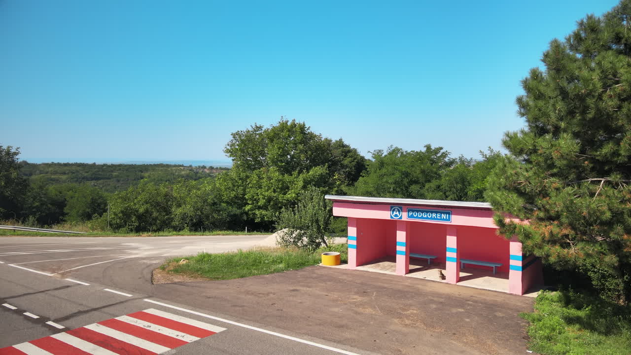 Aerial drone view of a bus station in Podgoreni, Moldova. Greenery around it