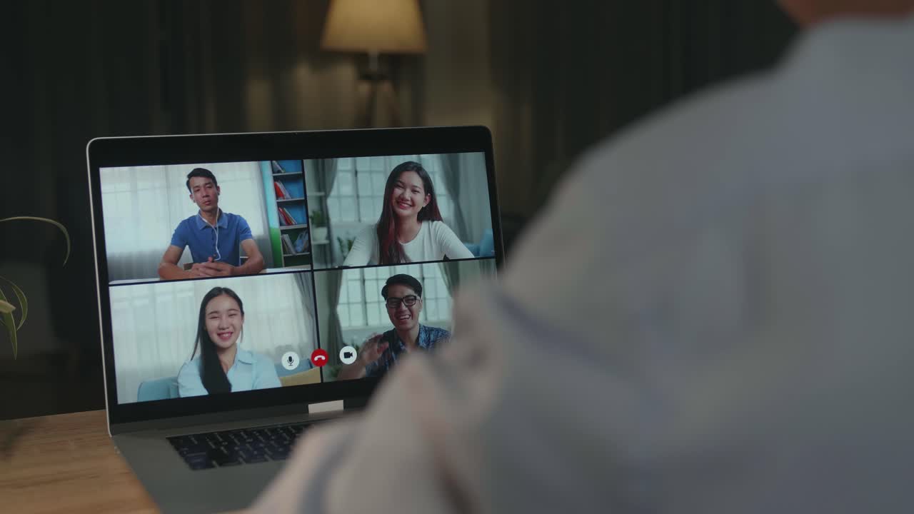 Online Meeting on Laptop at Night