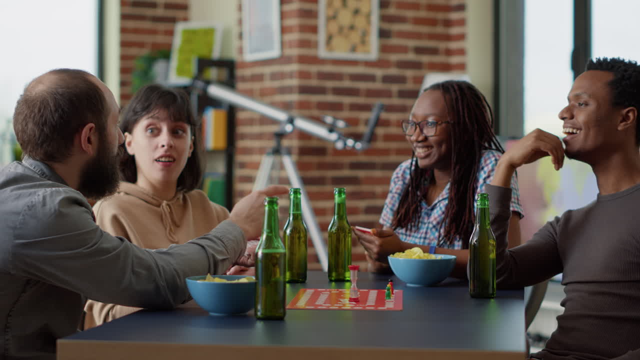 Diverse group of people playing board games with cards