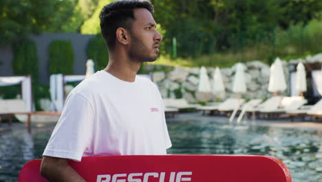 lifeguard looking around the swimming pool