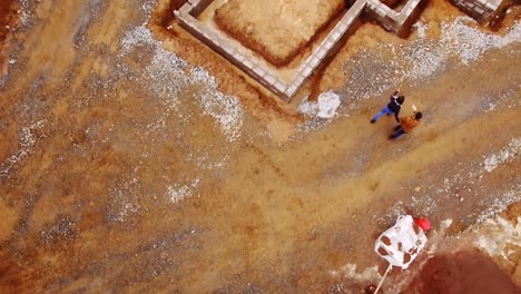 Couple-walking-near-construction-site