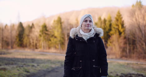 Smiling-Woman-With-White-Scarf-Looking-Into-Camera-3