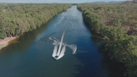 flying in front of a water skier during a slalom competition