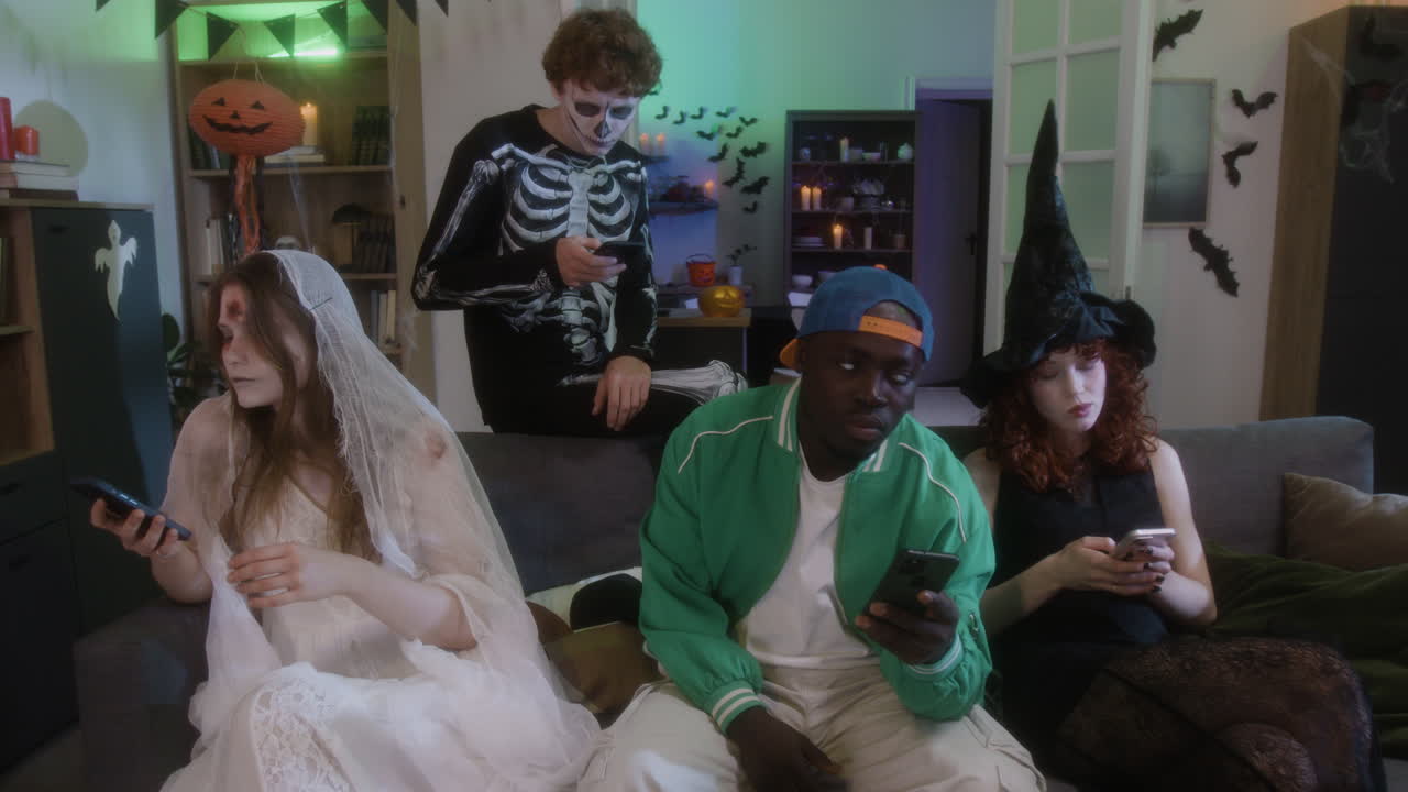 Halloween Party: Friends Texting in Costumes