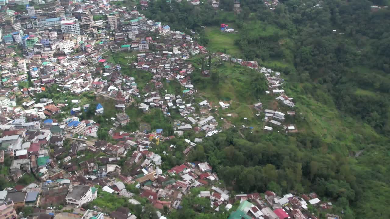 Expansion of a village leads to deforestation in a aerial view