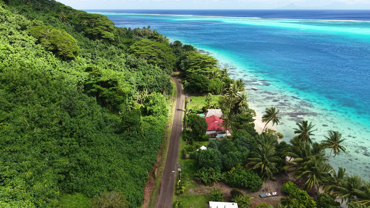 Aerial View of French Polynesia, Coastal Road on Huahine Island, Beachfront Homes and Turquoise Lagoon