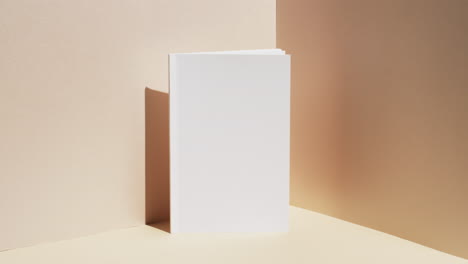 video of book with white blank pages and copy space on yellow background