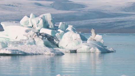 frozen arctic sea lagoon glacier panorama with icebergs and floes