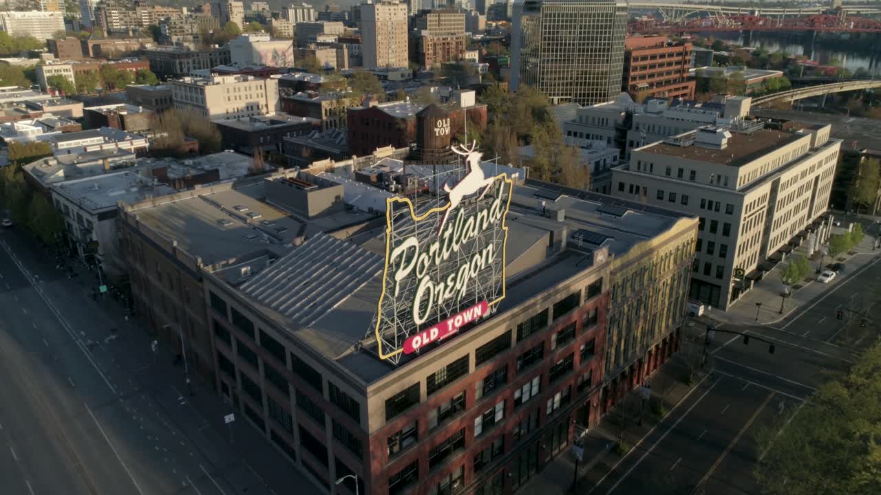 Historic aerial of Portland, Oregon's iconic Old Town sign with empty streets due to COVID-19.