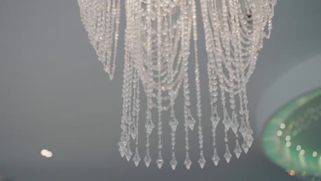 elegant crystal chandelier with intricate design in a stylish salon