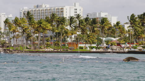 panning shot of resorts and holiday apartments in el boqueron bay area