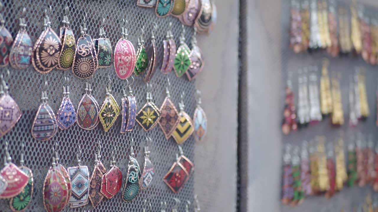 Colorful Handcrafted Enamel Earrings on Display