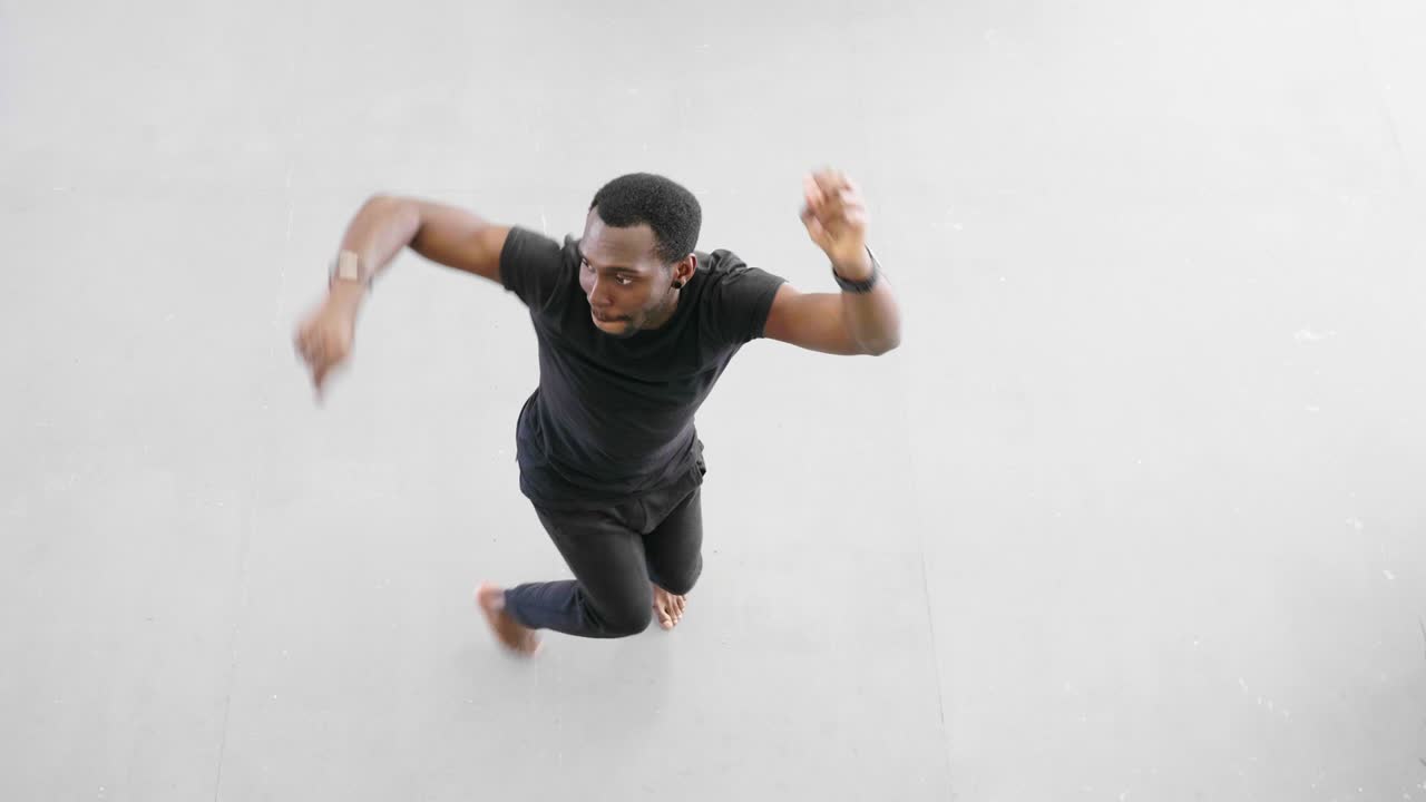 young hipster handsome afroamerican black man dancing hip hop style.