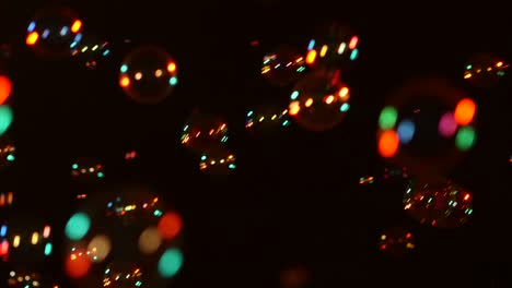 red soap bubbles on black background a lot of orange red soap bubbles isolated on black background