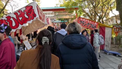 crowds gather and socialize at a traditional festival