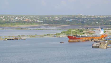 large commercial ships docked in the asphalt lakes of willemstad on the caribbean island of curacao