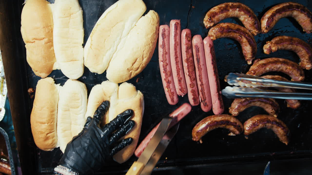 Cooking Spicy Sausage Sandwiches and Grilled Wurstel on the Street In Calabria