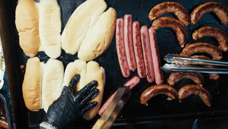 cooking spicy sausage sandwiches and grilled wurstel on the street in calabria