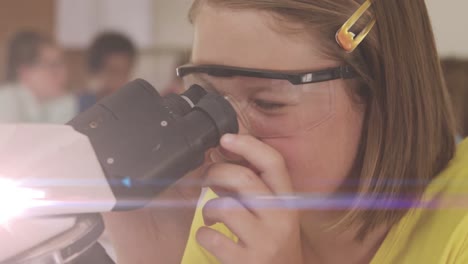 animation of light trails over caucasian schoolgirl using microscope