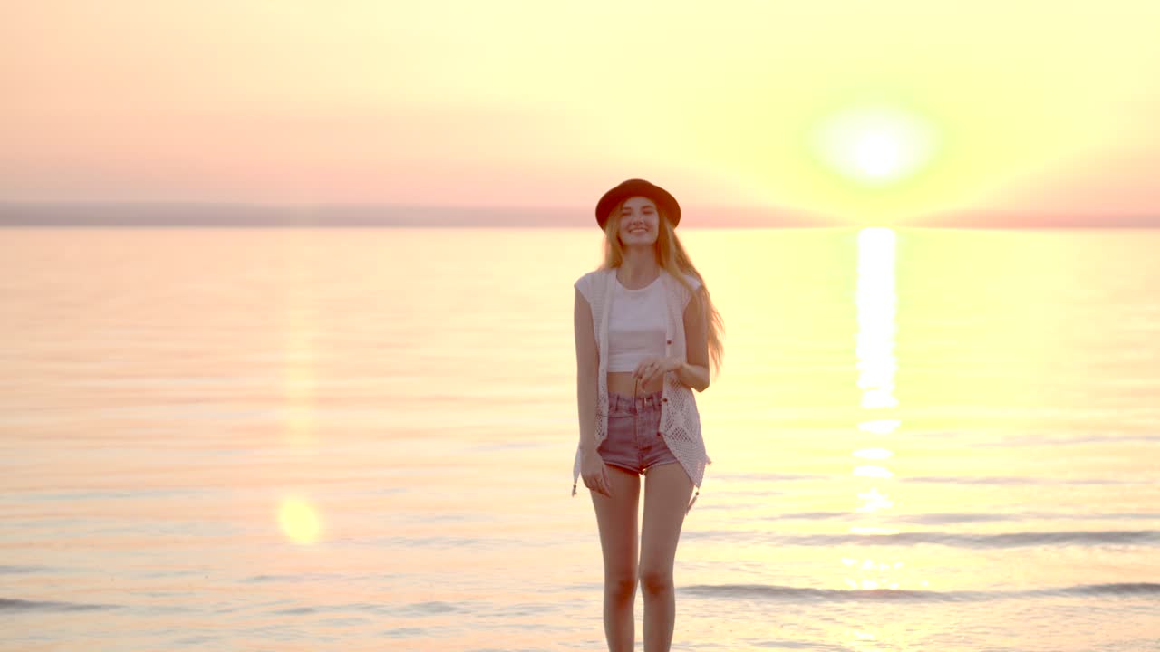 Woman enjoying sunset at the beach