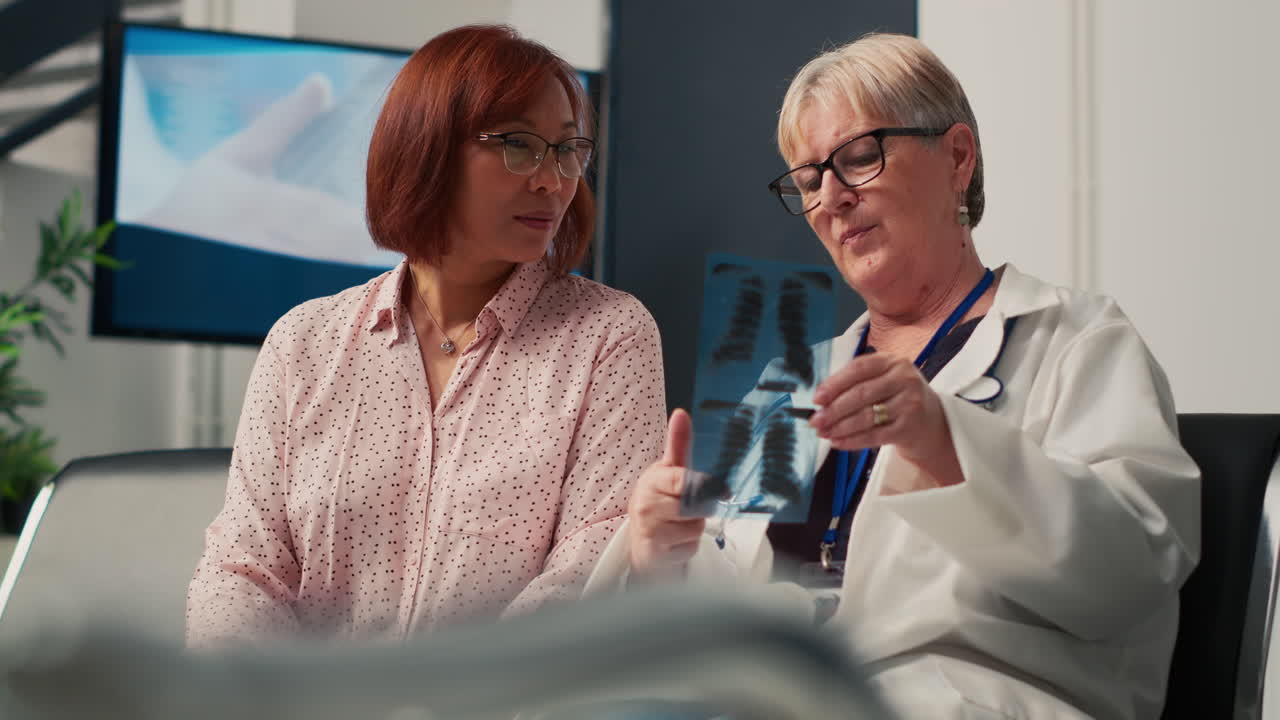 Doctor explaining x-ray results to patient