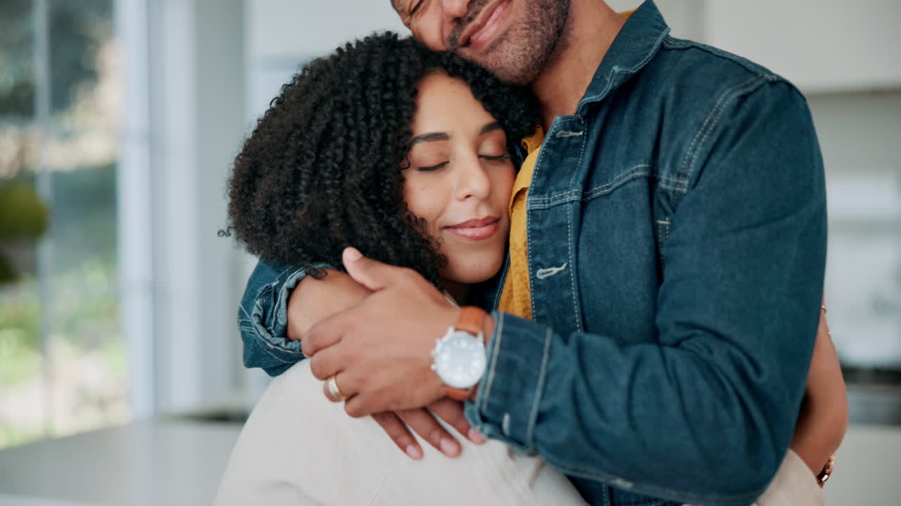 Affectionate couple embracing at home