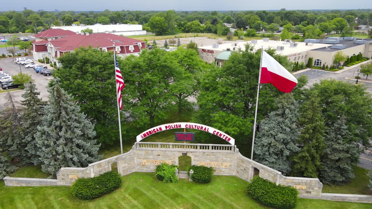 Polish Cultural Center with waving flags in Troy, Michigan, aerial view