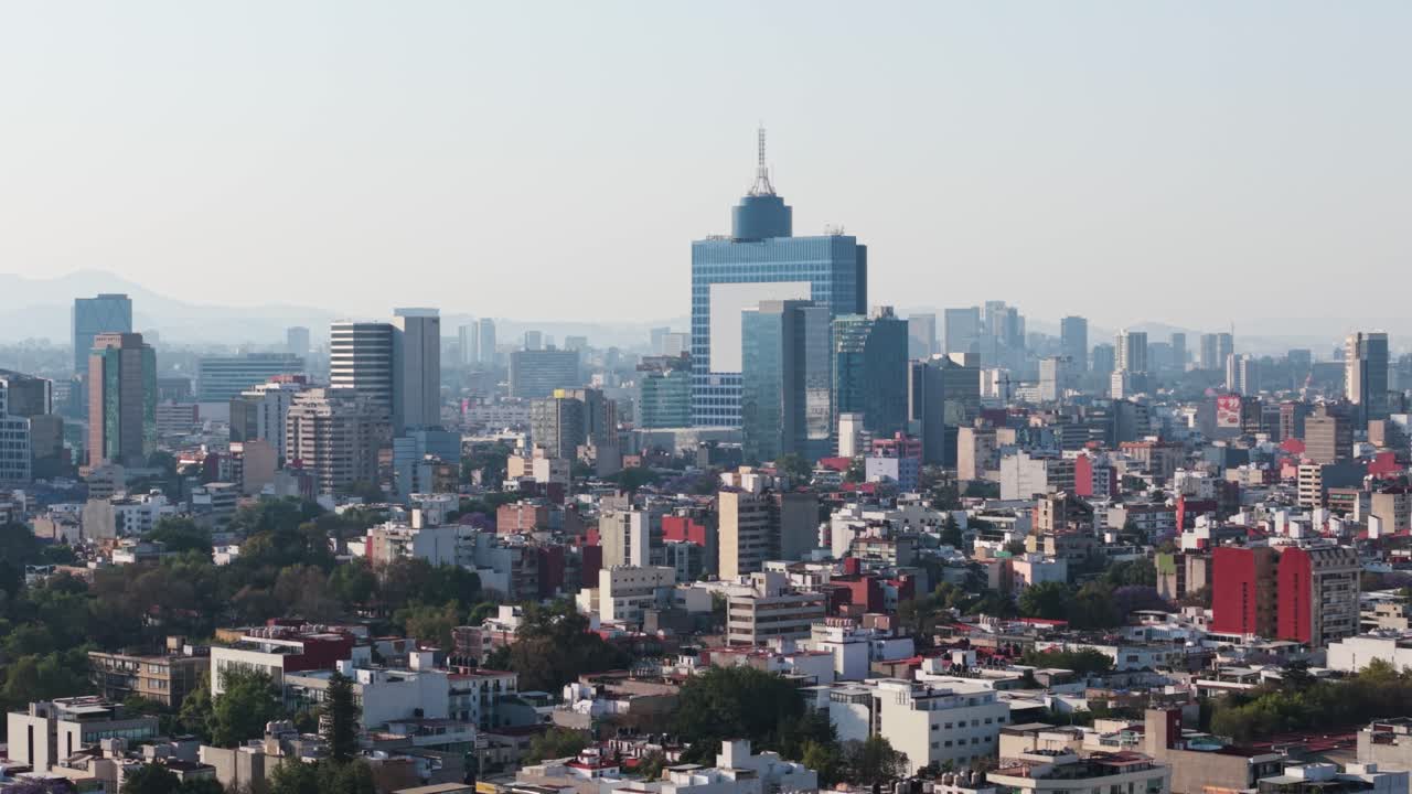 Drone footage of a distant perspective of CDMX, during a smoggy day