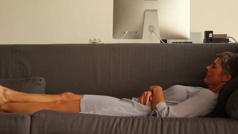 Businesswoman-sleeping-on-sofa-4k