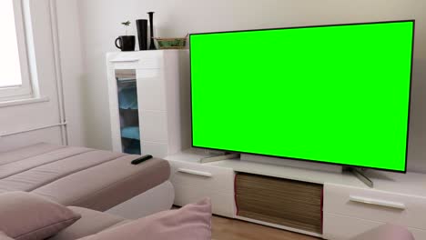 room with 4k flat screen tv with green screen