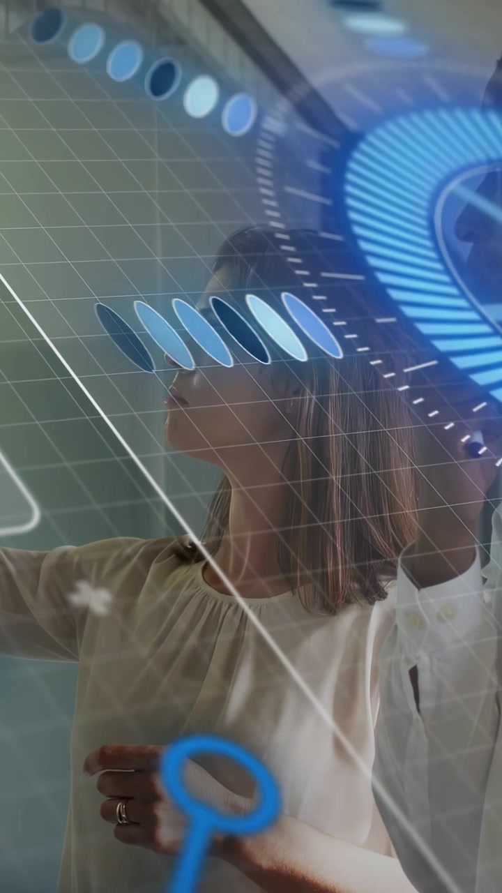 Vertical video: Woman reaching, tapping while checking IT data with HUD moving and peer watching