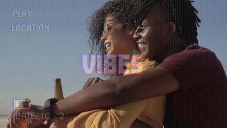 animation of text vibes over people by seaside