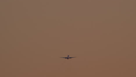 airplane taking off or landing in a dusty sky