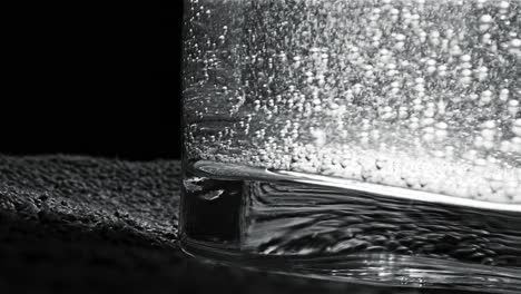 close-up of water bubbles in a glass