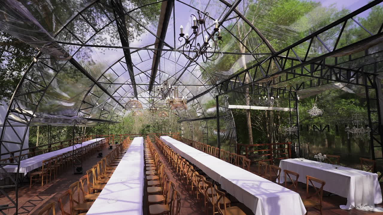 Transparent event hall surrounded by nature ready for formal banquet, exclusive jungle wedding destination, Parana, Iguazu, Argentina