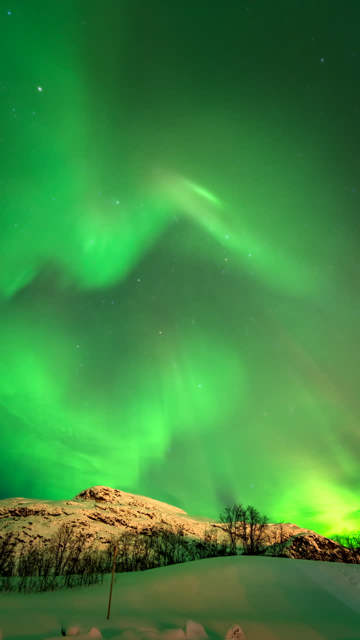 Emerald glowing nighttime scenery, natural sky phenomenon, timelapse