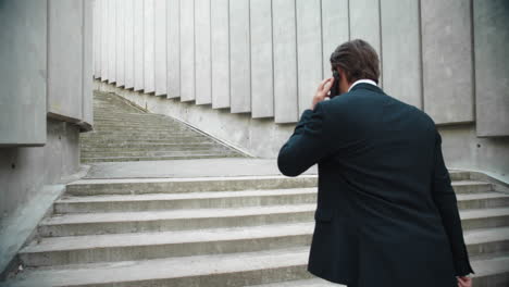 businessman walking for work in city