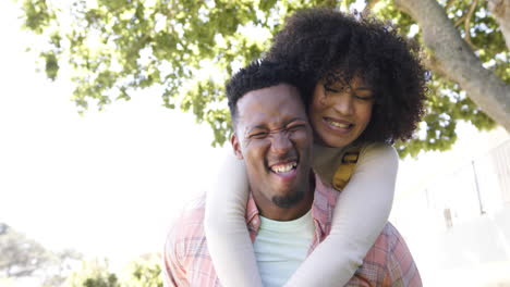 Portrait-of-happy-african-american-couple-embracing-in-garden-at-home,-slow-motion