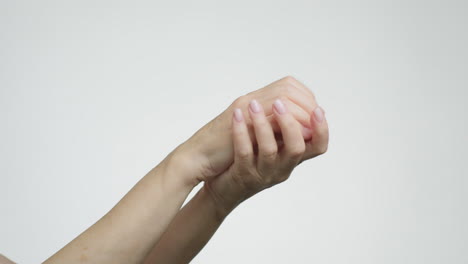 close-up of hands rubbing together, demonstrating skin care or hygiene