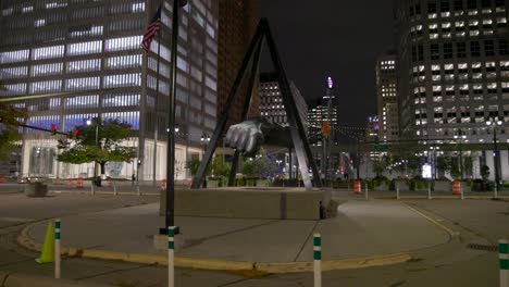 joe louis fist statue in detroit, michigan with gimbal video walking forward at night