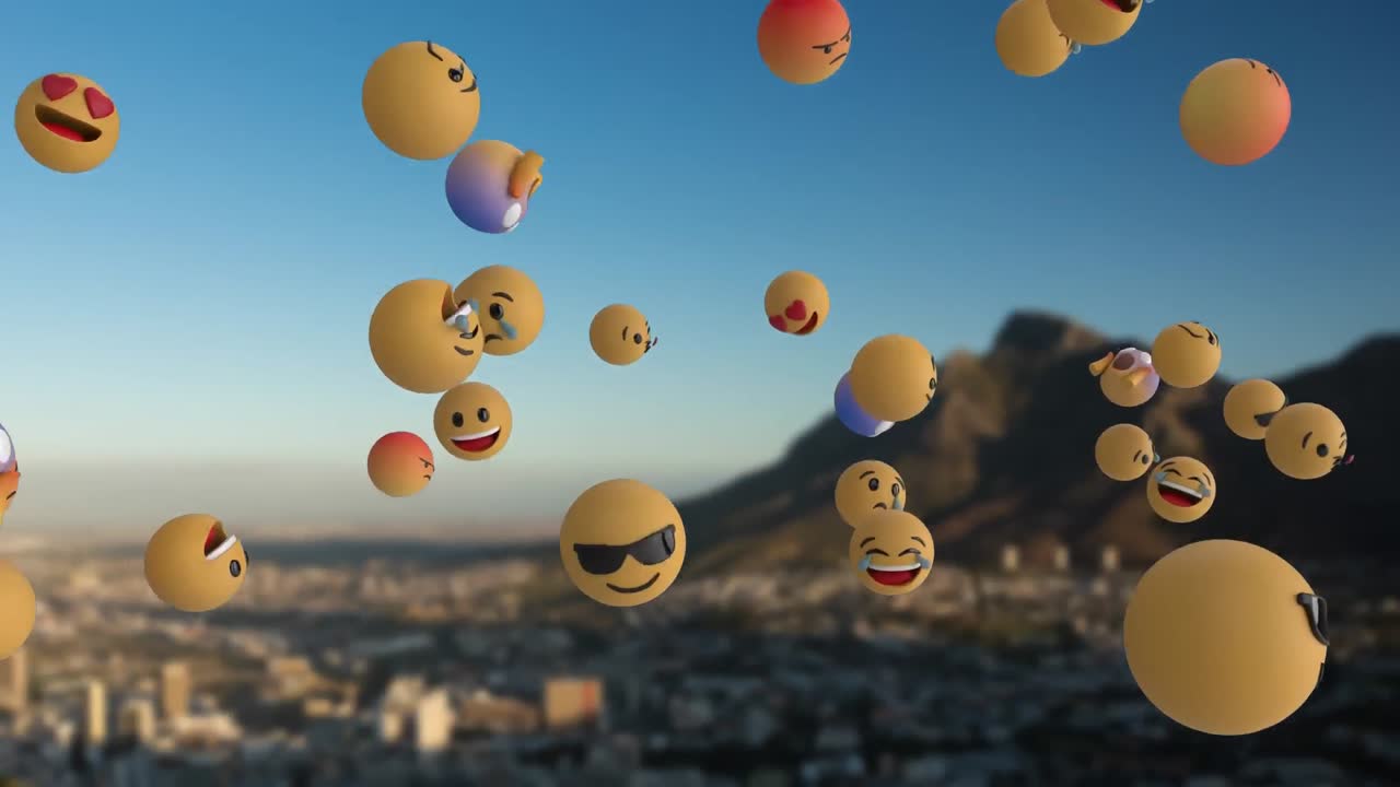 Icone emoji che volano su un paesaggio