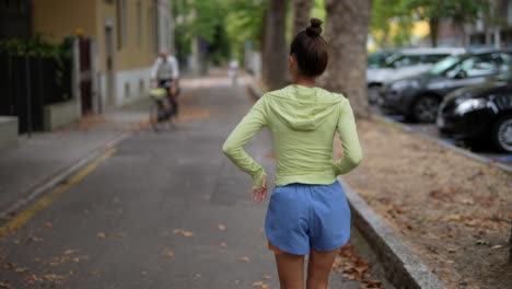 woman running on city street