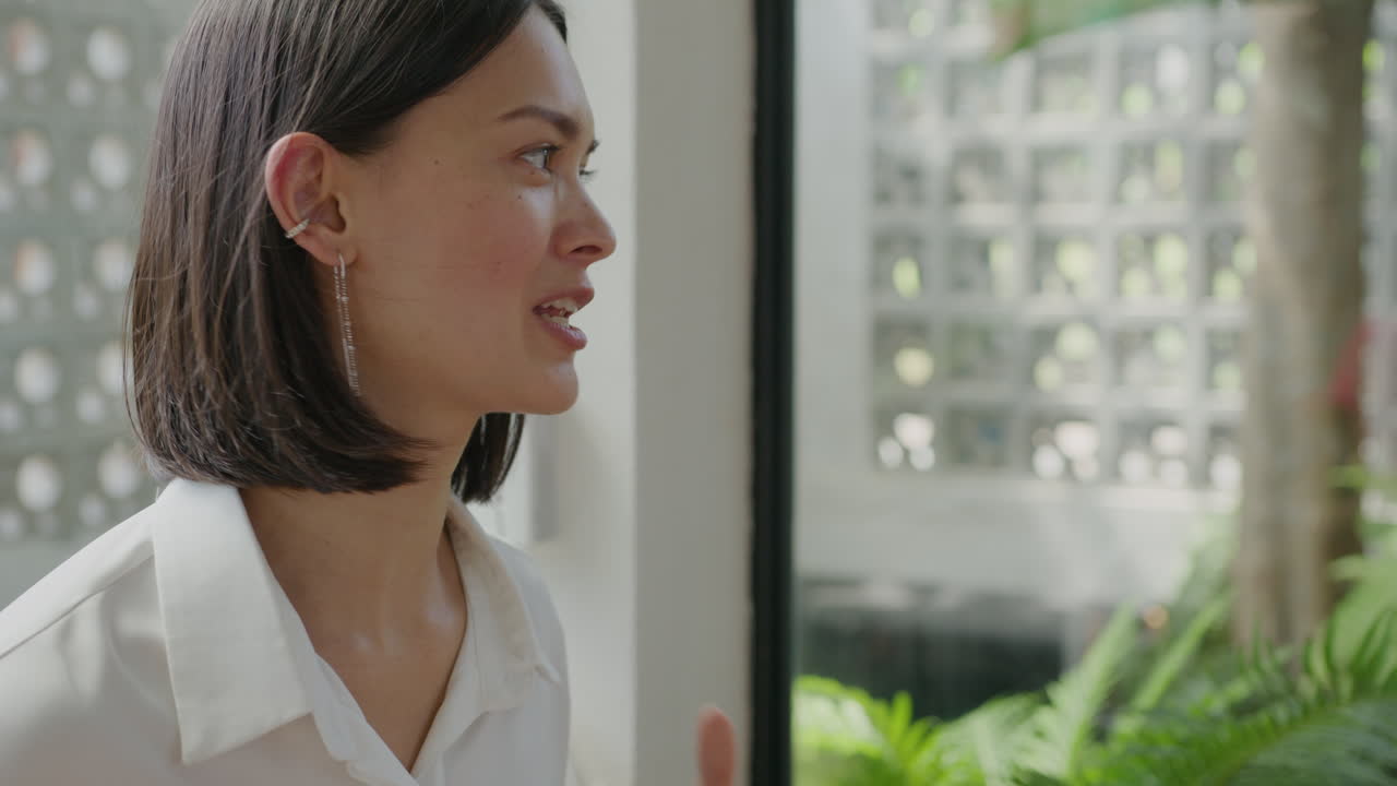 Businesswoman Writing in Copybook at Cafe Table