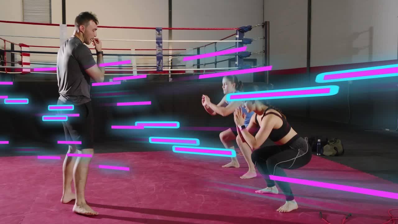 Coach stepping forward as two lowering ropes guiding sync squats in boxing neon streaks over limbs